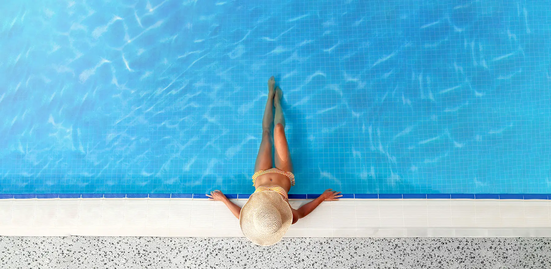 2 Woman Relaxing In Swimming Pool